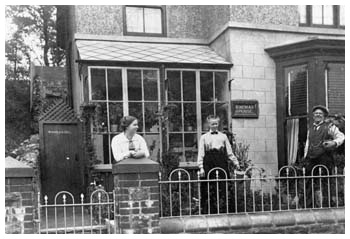 William Haggar pictured outside "Kinema House" in Abernant with his daughter and second wife.