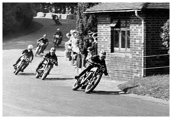 The photograph (Circa 1961) shows a group of riders between Ramsey and Maypole corners. The boating lake was to the right of the leading rider and has been known to be a cool-off point for some of the more inexperienced riders.