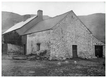 Dinas Ishaf Farm. An example of a long house, i.e. a single, long, low, oblong building which housed both family and cattle. Renovated in the 19th century, this example has a fire place beam dated 1638, but is itself possibly earlier in date. 